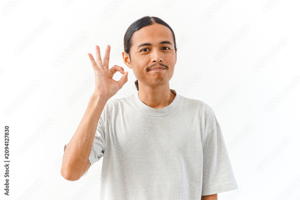 Naklejka premium Young Asian Man Gesturing OK Sign