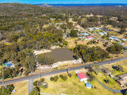 An aerial view of Emmaville with houses and fields in NSW, Australia