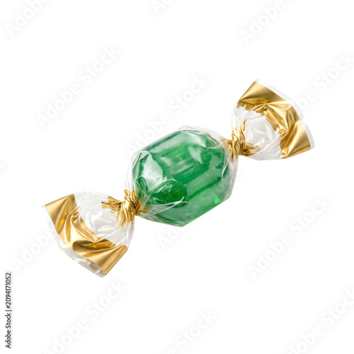 Green candy wrapped in gold and white foil isolated on transparent background