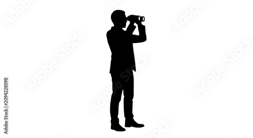 Silhouette of a man looking through handheld binoculars.