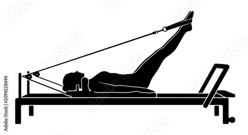 Woman using Pilates reformer for leg straps exercise silhouette.