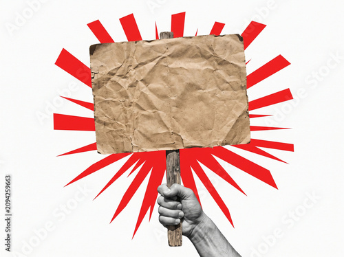 Protest sign held by hand