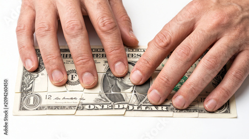 Hands holding jigsaw money