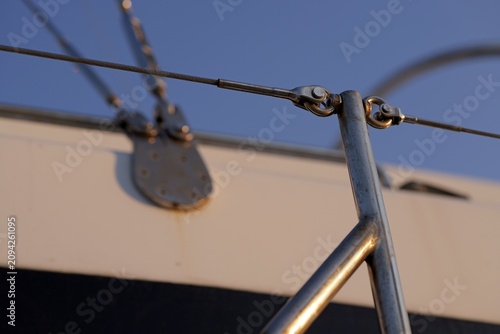 Stainless steel rigging on a boat deck at sunset