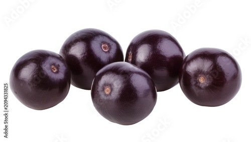 Isolated group of fresh ripe dark purple acai berries, healthy exotic superfood fruits