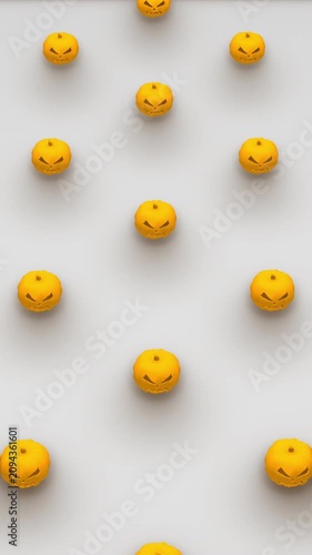 Holiday 3d render of pumpkin shapes is rotating in isometric view. Computer generated loop animation. Halloween pattern, 4K seamless vertical motion design