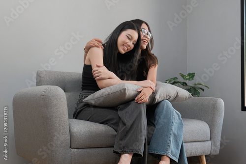 Young Asian Female Friends Enjoying a Relaxing Conversation at Home