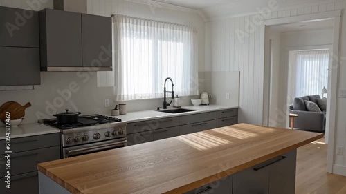 Modern Kitchen Interior with Elegant Design and Natural Light Streaming Through Window, Creating