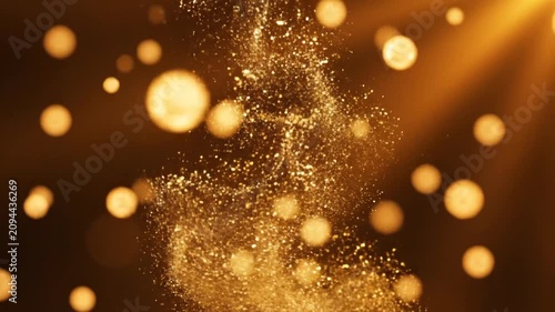 Golden sparkling spray with bokeh light on dark background
