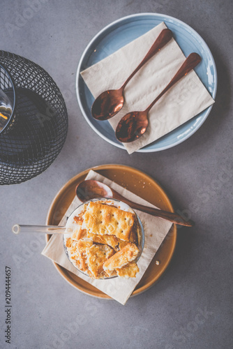 espresso with luscious cream and crushed biscuits scattered across the surface