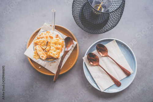 espresso with luscious cream and crushed biscuits scattered across the surface
