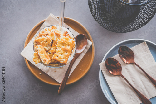 espresso with luscious cream and crushed biscuits scattered across the surface