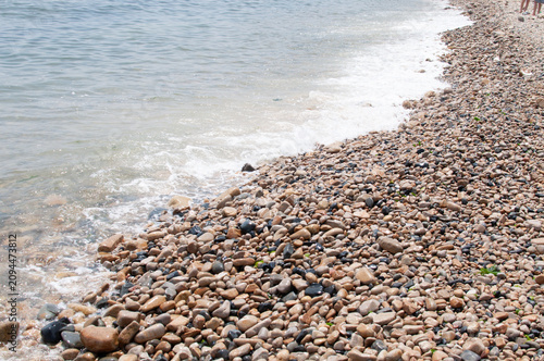 Sticker waves on the beach and pebbles