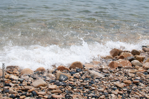 Sticker waves on the beach and pebbles