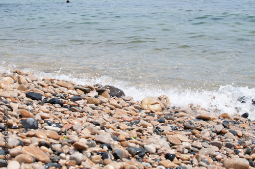 Canvas Print waves on the beach and pebbles