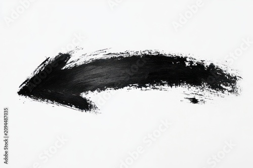 Bold black hand-painted arrow brushstroke pointing left on white background, expressive and dynamic