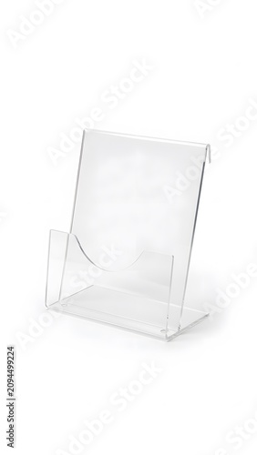 Empty clear acrylic brochure holder stand for countertop display on white background surface