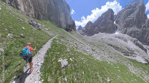 Hiker approaching Bocca di Brenta on the Via Ferrata Bocchette Centrali, Brenta Dolomites, Italy
