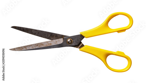 Fotografija Isolated vibrant yellow handled office scissors with open rusty metal blades for cutting
