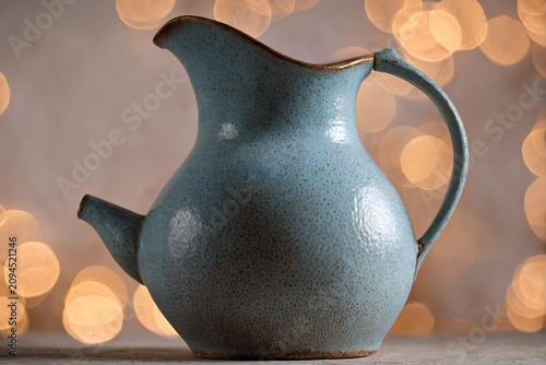 Vintage Ceramic Pitcher with Bokeh Lights