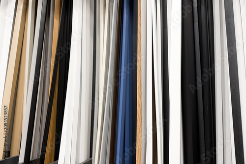 Cuadro en lienzo Various wood and painted molding samples arranged vertically