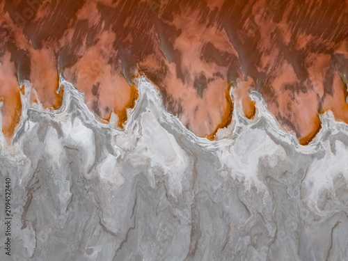 An aerial view shows the vibrant red Great Salt Lake textures