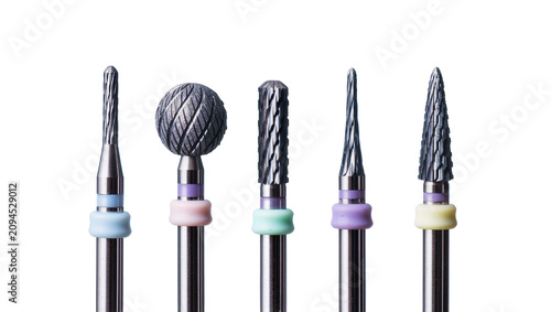 Isolated professional set of five dental burs and drills for precise dentistry work