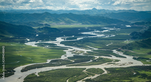Epic Aerial Panorama of Yellow River Wetland: Mountain Ranges, Braided Water Systems and Winding Rivers in Zoige Grassland