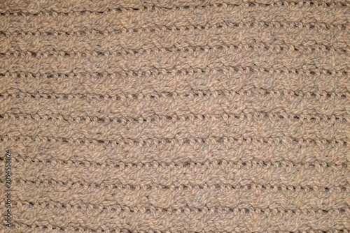 Obraz na plátně Close-up top view of beige knitted textile texture