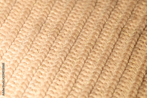 Foto Soft beige knit fabric fading into blur, perspective view
