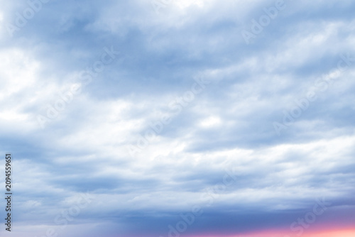 Voluminous Evening Clouds Bathed in Warm Sunset Glow