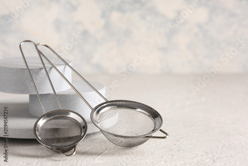 Two stainless steel tea str...