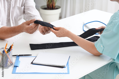 Doctor giving compression s...
