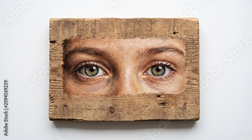 Closeup of Boy Hiding Behind a Book and Cardboard Box with Eyes Peeking Out Halloween Mask Concept Portrait and Mystery Expression on Face