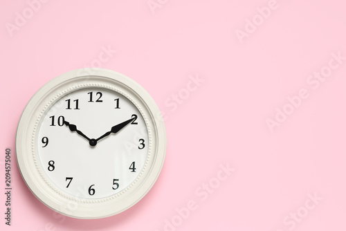 White round wall clock with...
