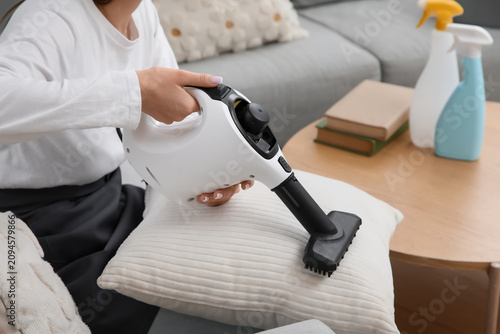 Female janitor steam cleani...