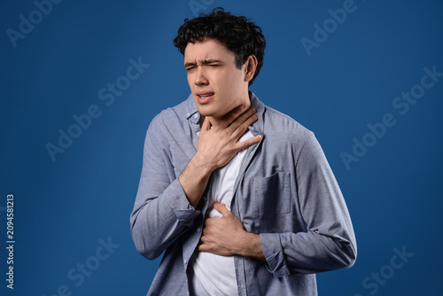 Young man having panic atta...