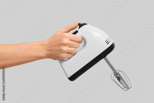 Female hand with electric m...