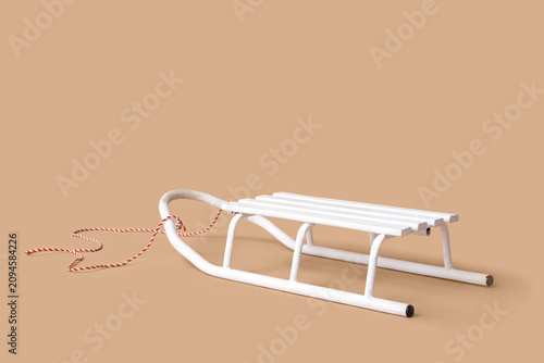 Cuadro en lienzo White empty sled on beige background