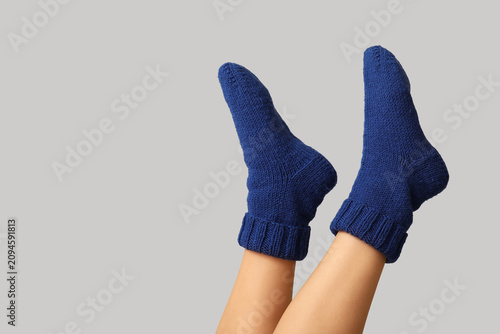 Legs of young woman in blue...