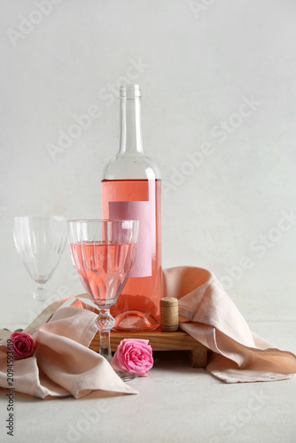 Glass, bottle of pink wine ...