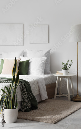 Interior of light bedroom w...