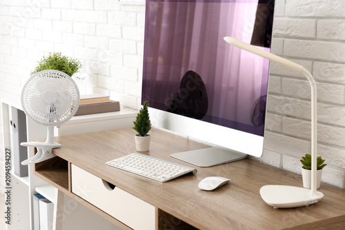 Modern electric fan on tabl...