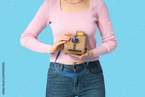Young woman with paper inst...