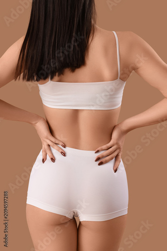 Young woman in white underw...