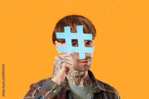 Cool tattooed young man wit...