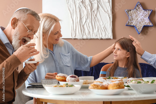 Happy Jewish family having ...