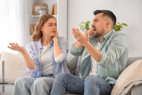 Young couple suffering from...