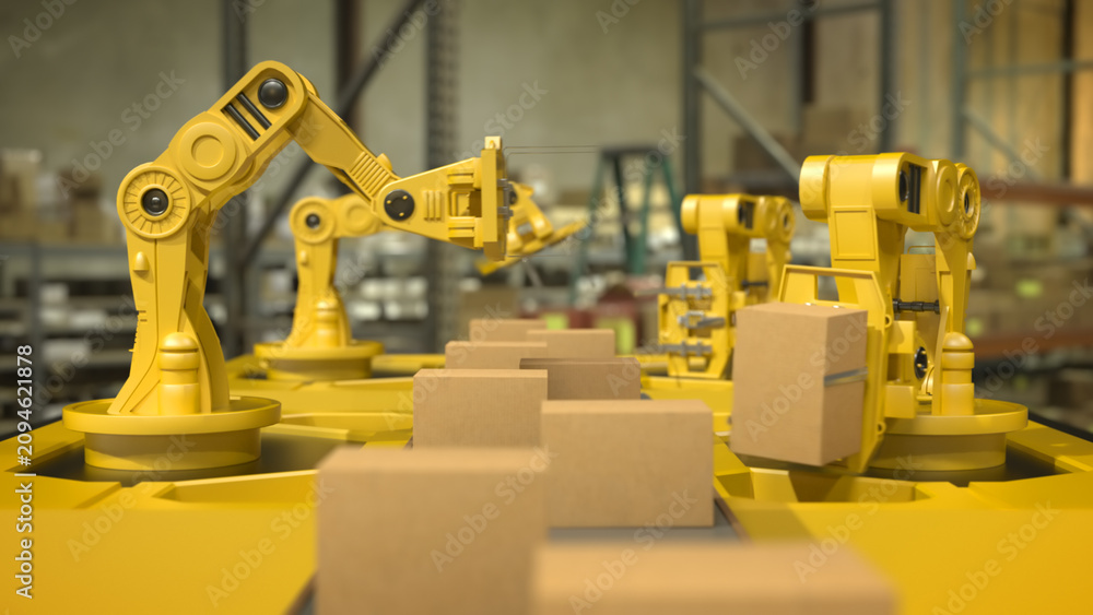 Fototapeta premium Yellow robotic arms handling cardboard boxes on a conveyor line inside a warehouse with blurred industrial background and warm lighting.