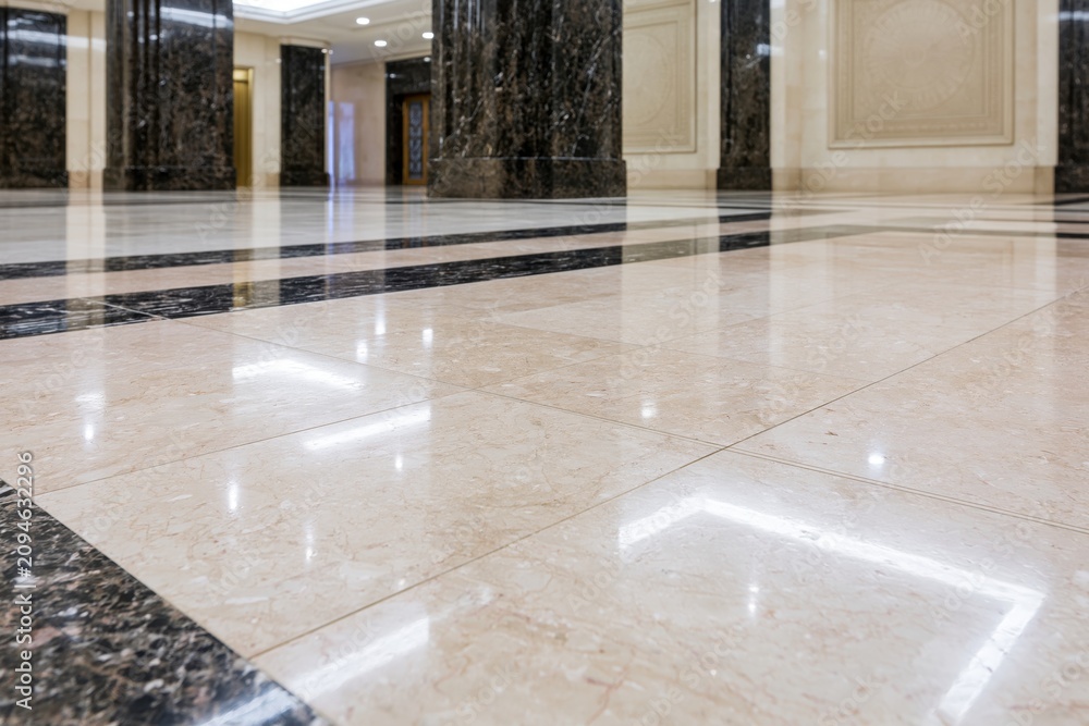 Obraz premium The Marble Floor in a Grand Hotel Lobby with Polished Reflective Surfaces